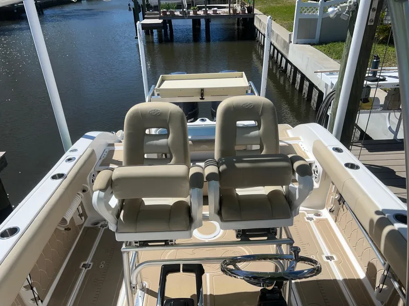 Slide: The Image of 2016 Sea Fox 266 Commander boat interior with dual helm seats and steering wheel. - 13