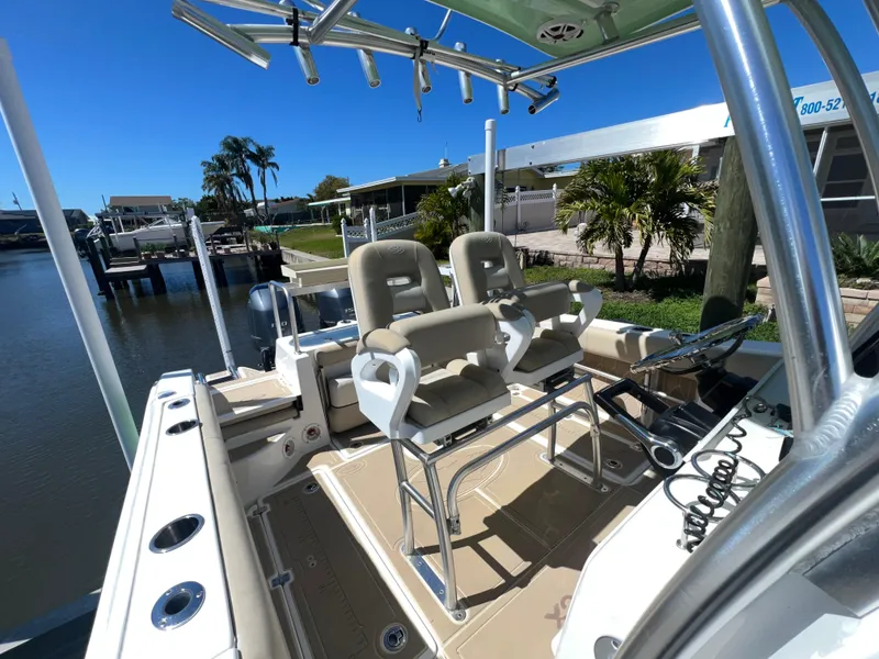 Slide: The Image of 2016 Sea Fox 266 Commander boat interior with dual seats and fishing rod holders. - 14