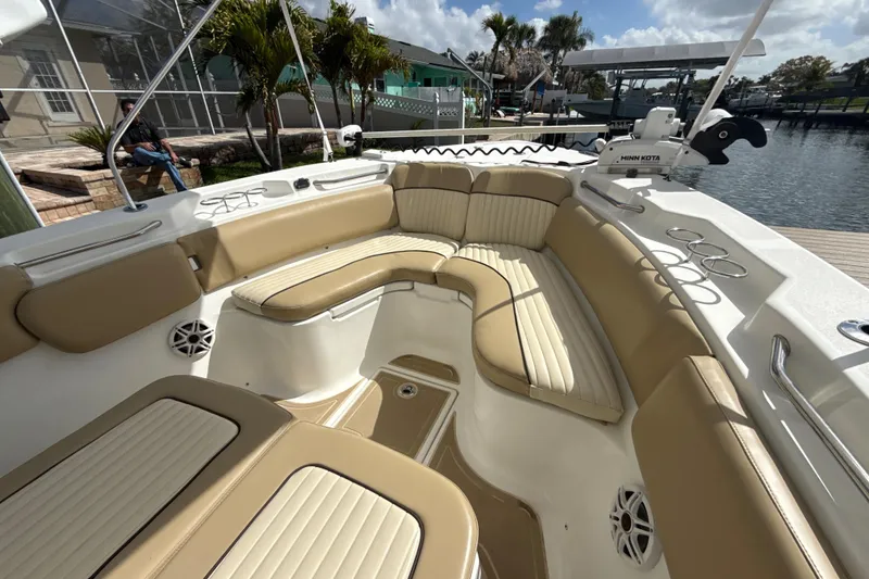 Slide: The Image of 2016 Sea Fox 266 Commander boat with tan seating and fishing rod holders. - 15