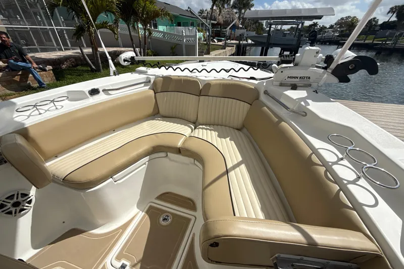 Slide: The Image of 2016 Sea Fox 266 Commander boat with tan seating and Minn Kota trolling motor. - 16