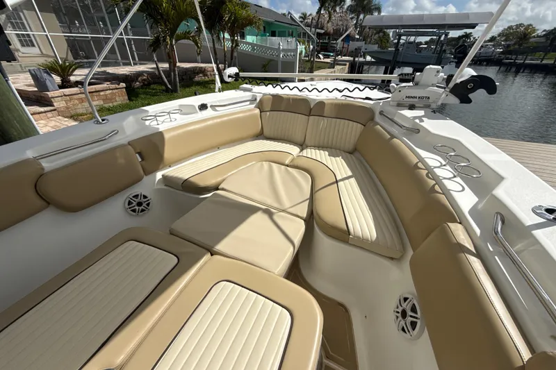 Slide: The Image of 2016 Sea Fox 266 Commander boat with tan seating and fishing rod holders. - 17