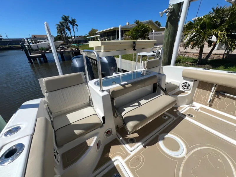 Slide: The Image of 2016 Sea Fox 266 Commander boat interior with seating and fishing rod holders. - 22