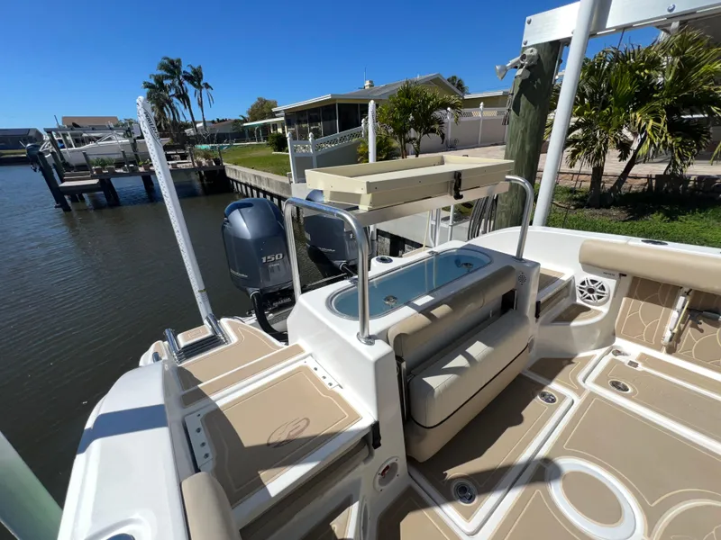 Slide: The Image of 2016 Sea Fox 266 Commander boat with Yamaha engine, docked by waterfront homes. - 23