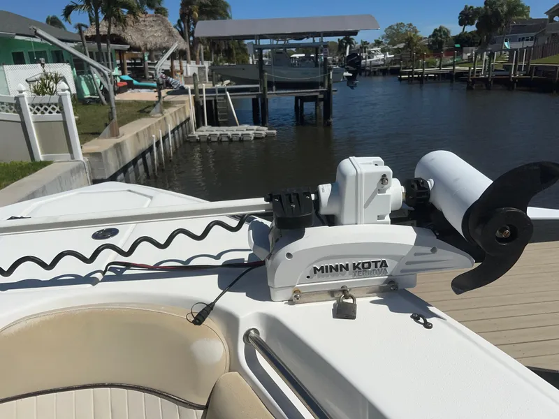 Slide: The Image of 2016 Sea Fox 266 Commander with Minn Kota trolling motor at a dockside location. - 30