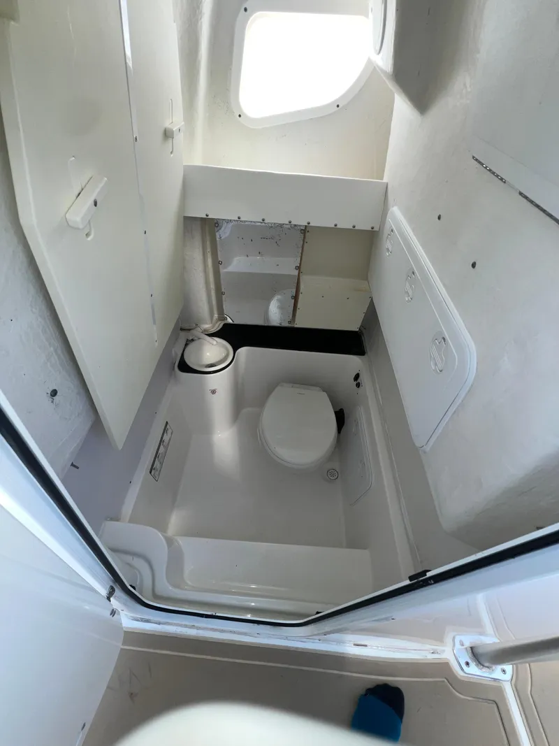 Slide: The Image of Interior of 2016 Sea Fox 266 Commander boat bathroom with toilet and window. - 31