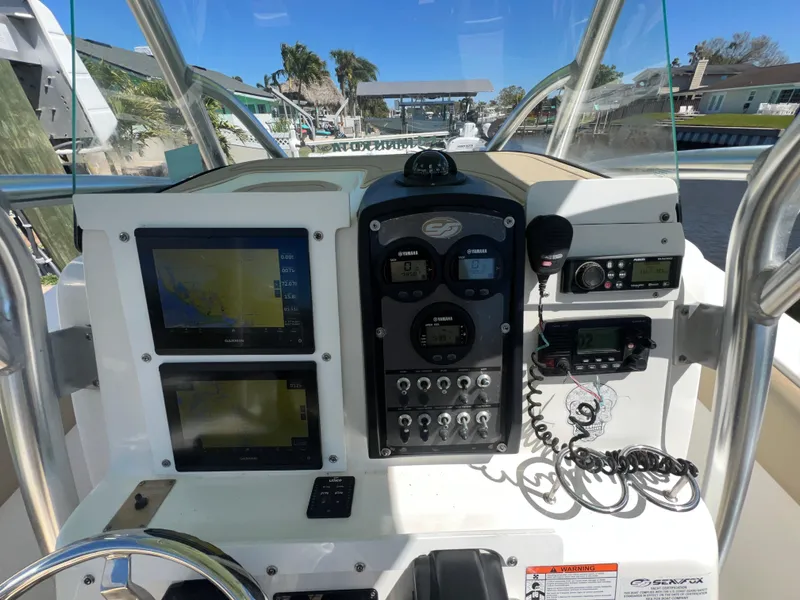Slide: The Image of 2016 Sea Fox 266 Commander boat dashboard with navigation and communication equipment. - 32