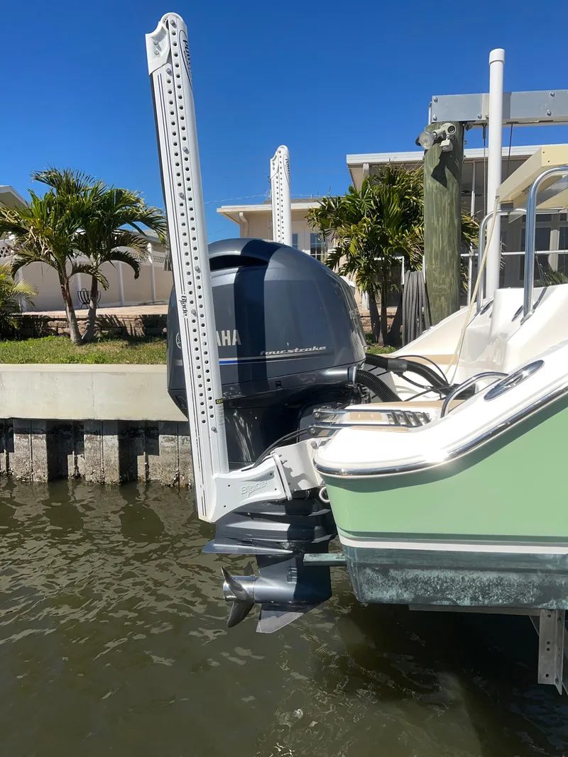Slide: The Image of 2016 Sea Fox 266 Commander boat with Yamaha outboard motor docked by waterfront. - 33