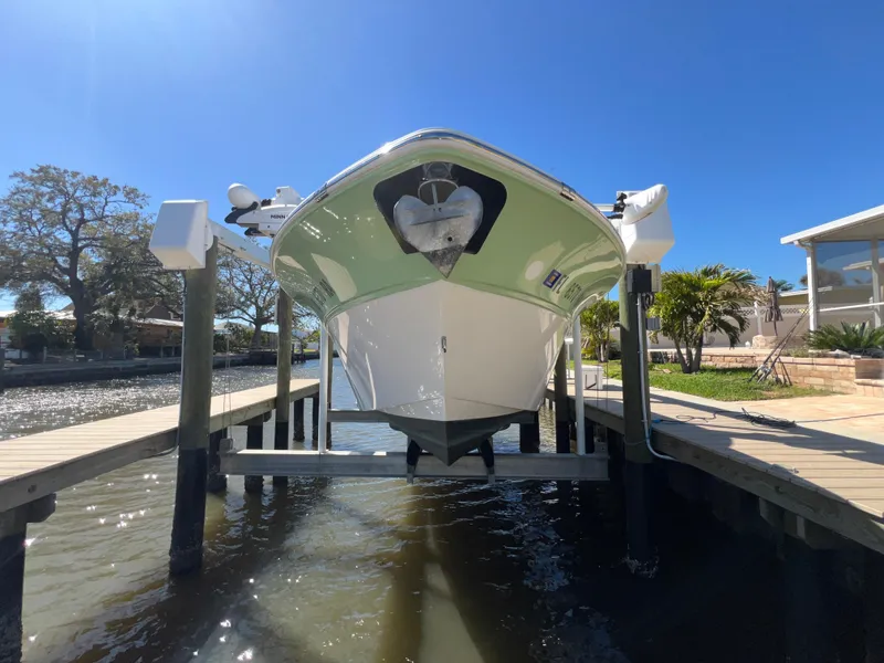 Slide: The Image of 2016 Sea Fox 266 Commander boat on lift, docked by waterfront property. - 4