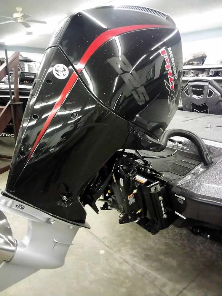 Slide: The Image of 2025 Ranger Z519R Cup-Equipped boat engine, black with red accents, in a garage setting. - 10