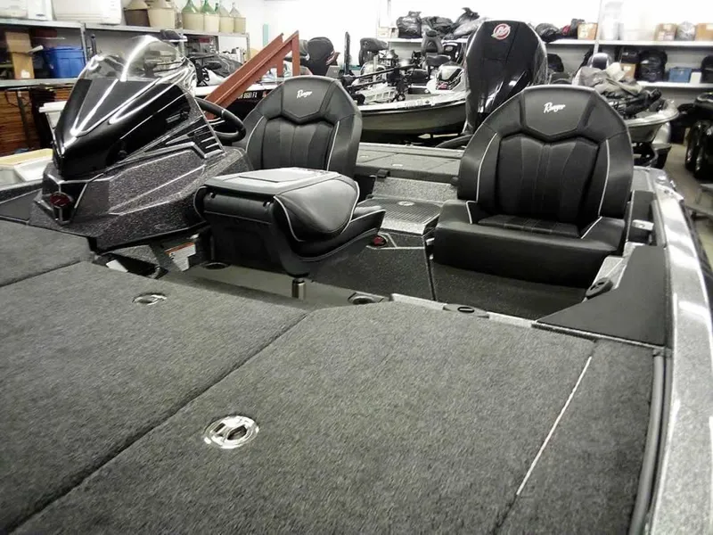 Slide: The Image of 2025 Ranger Z519R Cup-Equipped boat interior with dual seats and storage compartments. - 11