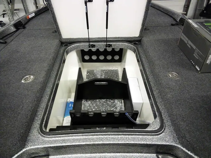 Slide: The Image of 2025 Ranger Z519R Cup-Equipped boat storage compartment with organized interior layout. - 14