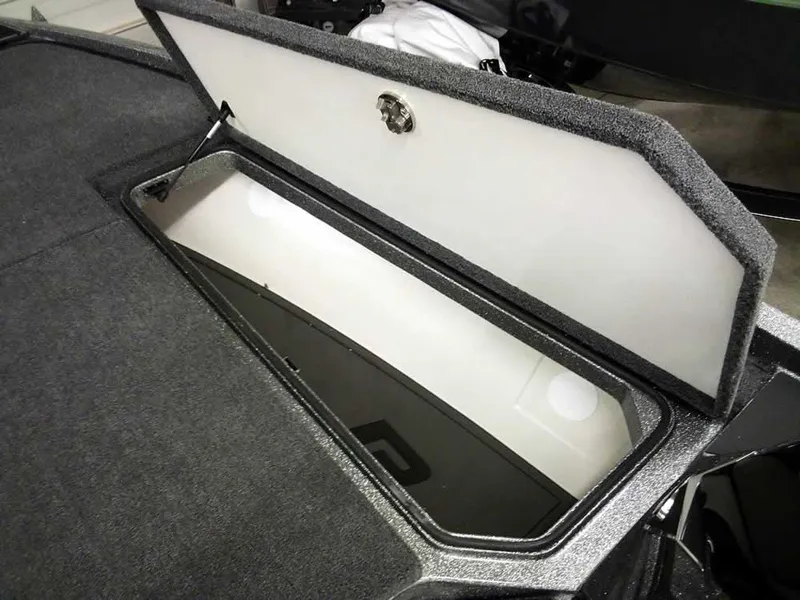 Slide: The Image of 2025 Ranger Z519R Cup-Equipped storage compartment, open lid, spacious interior. - 16