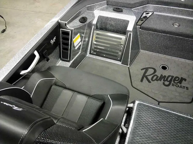 Slide: The Image of 2025 Ranger Z519R Cup-Equipped boat interior with black seating and Ranger Boats logo. - 23