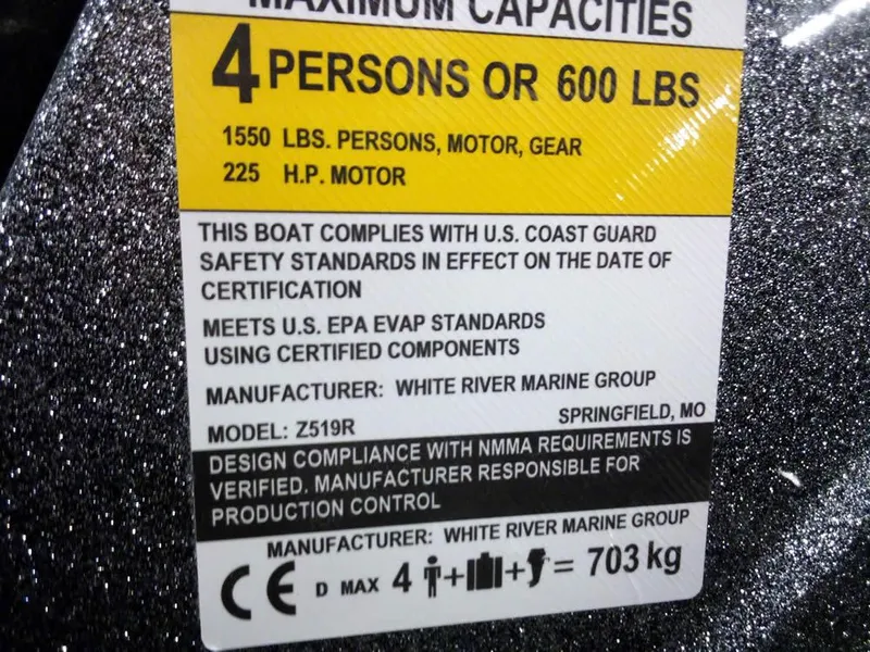 Slide: The Image of 2025 Ranger Z519R Cup-Equipped boat capacity label, 4 persons or 600 lbs, safety standards compliance. - 25