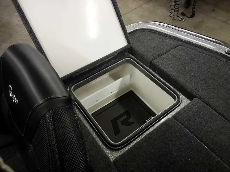 Slide: The Image of 2025 Ranger Z519R Cup-Equipped storage compartment with open lid, showcasing interior design. - 34