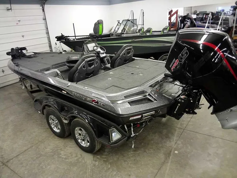 Slide: The Image of 2025 Ranger Z519R Cup-Equipped boat in showroom, featuring dual seats and powerful outboard motor. - 37