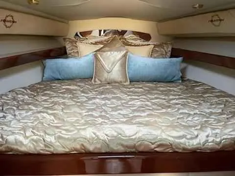 Slide: The Image of Luxurious cabin interior of 2006 Fountain 38 Express Cruiser with elegant bedding. - 15