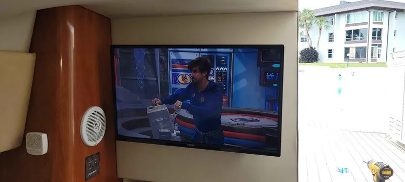 Slide: The Image of Interior of 2006 Fountain 38 Express Cruiser with TV and speaker system. - 17