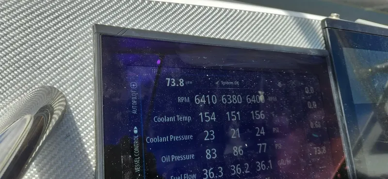 Slide: The Image of Dashboard display of a 2006 Fountain 38 Express Cruiser showing RPM, coolant, and oil pressure. - 22