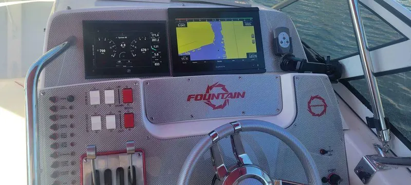 Slide: The Image of 2006 Fountain 38 Express Cruiser dashboard with navigation screens and controls. - 7