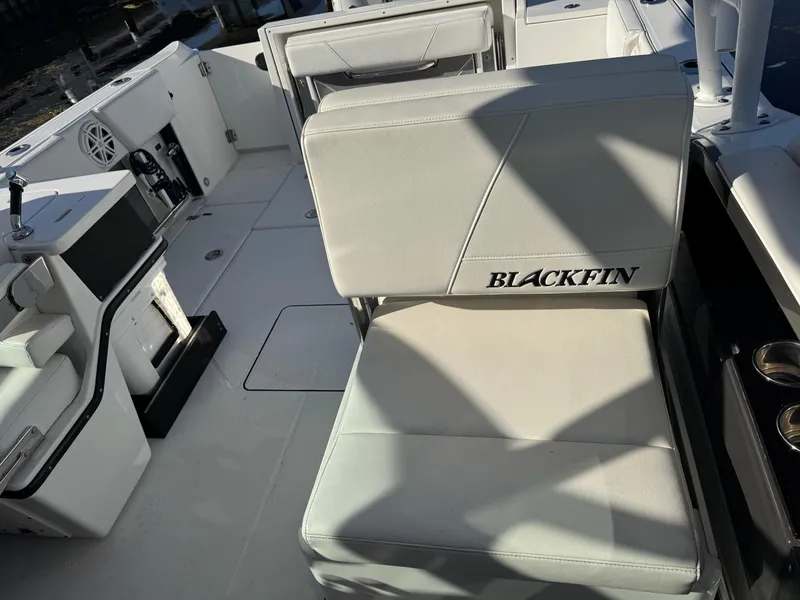 Slide: The Image of 2021 Blackfin 252DC boat interior with cushioned seating and modern design. - 33