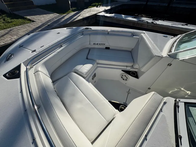 Slide: The Image of 2021 Blackfin 252DC boat interior with white seating and speaker system. - 38