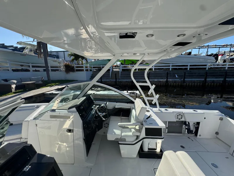 Slide: The Image of 2021 Blackfin 252DC boat interior with helm, seating, and modern design features. - 42