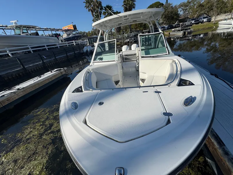 Slide: The Image of 2021 Blackfin 252DC boat docked, featuring sleek design and spacious seating area. - 45