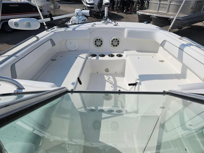 Slide: The Image of 2014 Carolina Cat 230 DC boat interior with seating and speakers. - 11