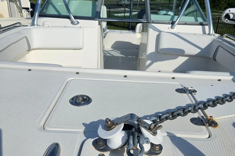 Slide: The Image of 2014 Carolina Cat 230 DC boat interior with anchor chain and seating area. - 13