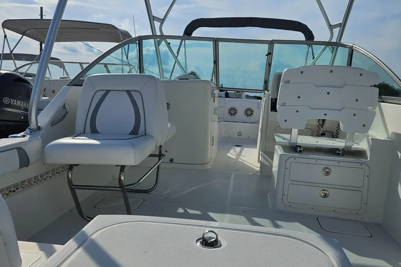 Slide: The Image of 2014 Carolina Cat 230 DC boat interior with seating and dashboard. - 14