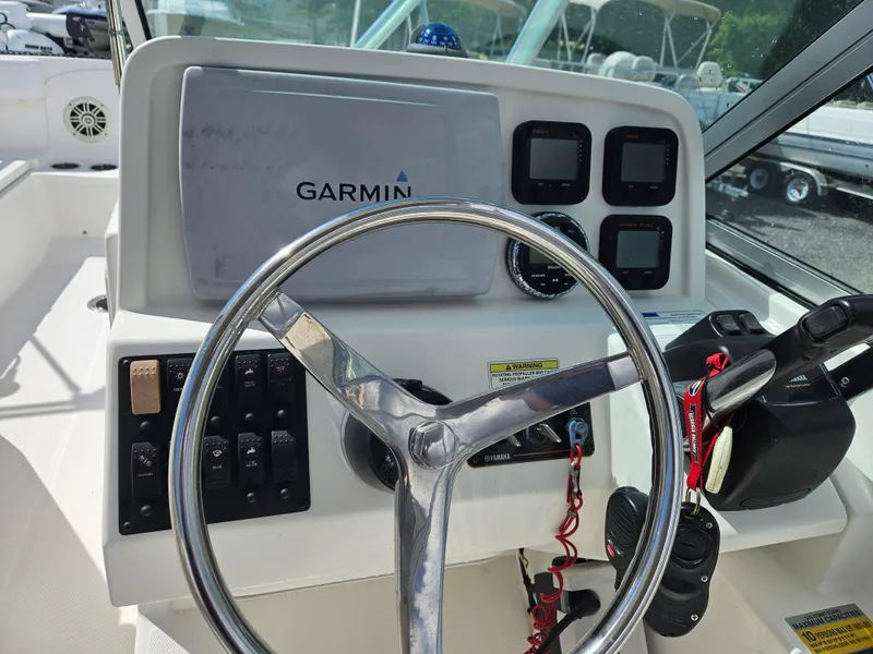 Slide: The Image of Steering console of a 2014 Carolina Cat 230 DC boat with Garmin navigation system. - 15