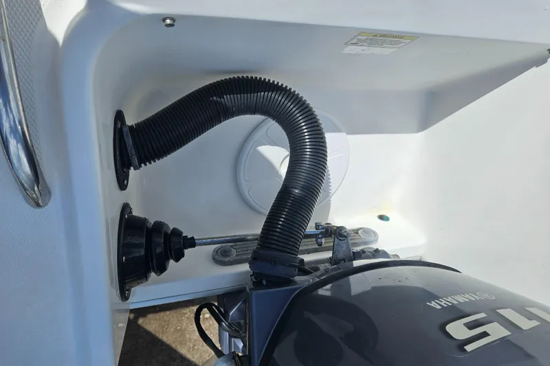 Slide: The Image of Close-up of a 2014 Carolina Cat 230 DC boat engine compartment with Yamaha motor. - 37