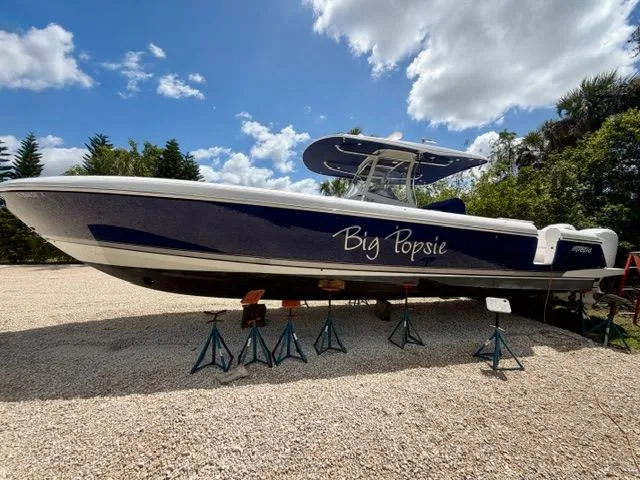 Slide: The Image of 2021 Intrepid Nomad 407 boat on stands outdoors. - 15