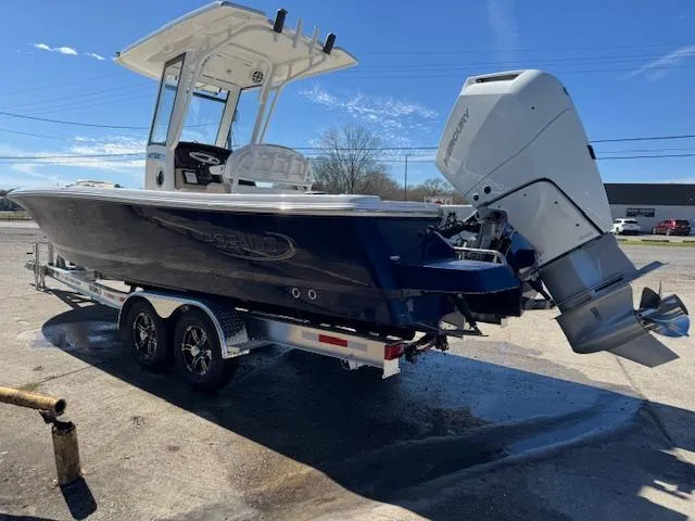 The Image of 2025 Robalo 266 Cayman boat on trailer, featuring sleek design and powerful outboard engine. - 0