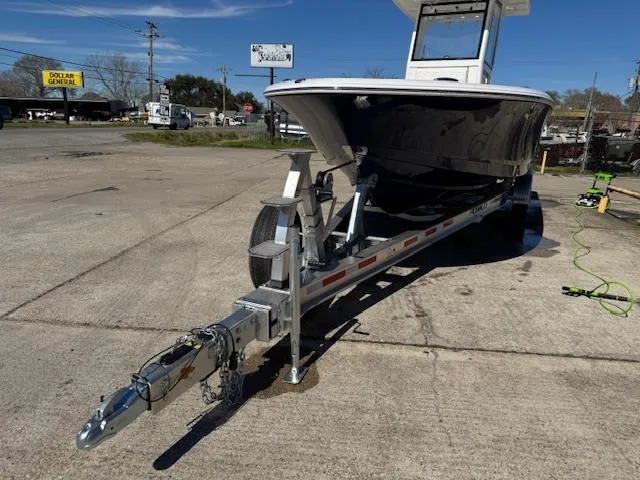 Slide: The Image of 2025 Robalo 266 Cayman boat on trailer in outdoor setting. - 1