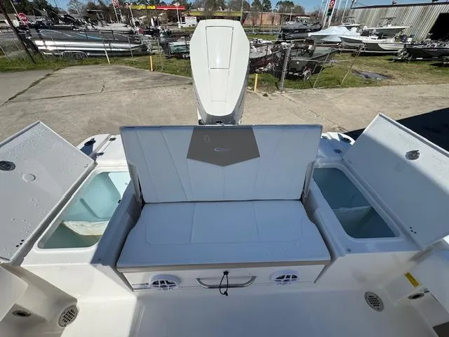 Slide: The Image of 2025 Robalo 266 Cayman boat interior with storage compartments and seating. - 20