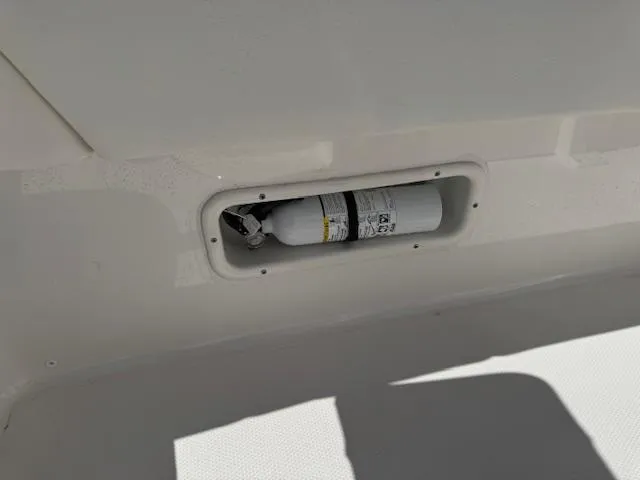 Slide: The Image of Fire extinguisher compartment on 2025 Robalo 266 Cayman boat. - 25