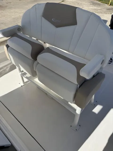 Slide: The Image of 2025 Robalo 266 Cayman boat seating with white and gray upholstery. - 28
