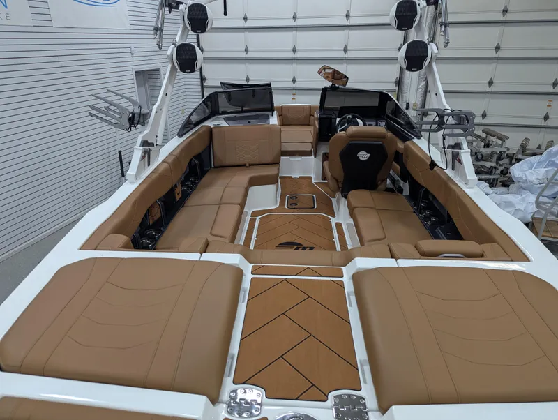 Slide: The Image of 2025 Malibu Wakesetter 23 LSV interior with tan seating and modern design. - 11