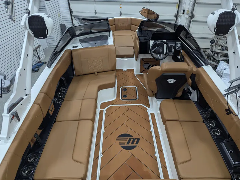 Slide: The Image of 2025 Malibu Wakesetter 23 LSV interior with tan seating and sleek design. - 12