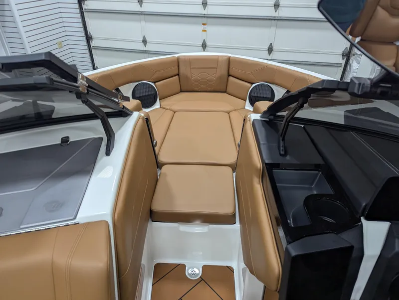 Slide: The Image of 2025 Malibu Wakesetter 23 LSV interior with tan leather seating and modern design. - 14