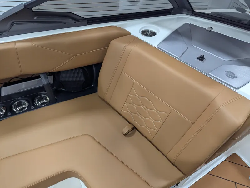 Slide: The Image of 2025 Malibu Wakesetter 23 LSV interior with tan leather seating and modern design. - 15