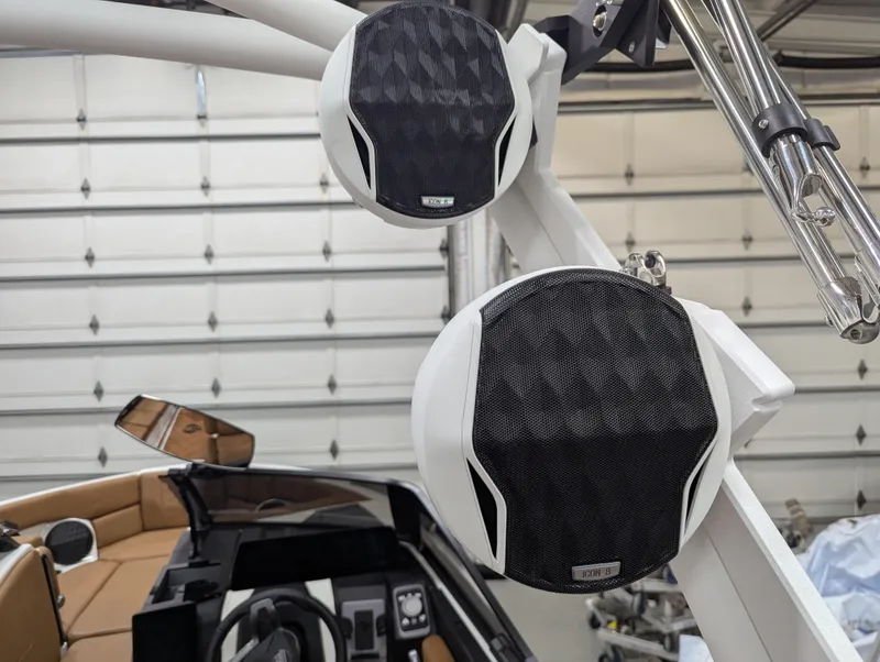 Slide: The Image of 2025 Malibu Wakesetter 23 LSV boat speakers in a garage setting. - 19