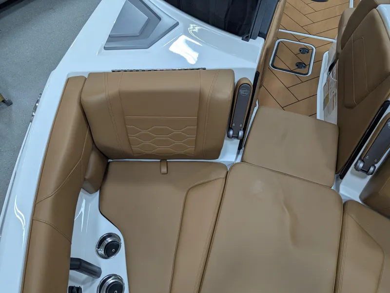 Slide: The Image of 2025 Malibu Wakesetter 23 LSV interior with tan leather seating and modern design. - 22
