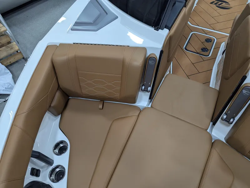 Slide: The Image of 2025 Malibu Wakesetter 23 LSV interior with tan leather seating and modern design. - 23