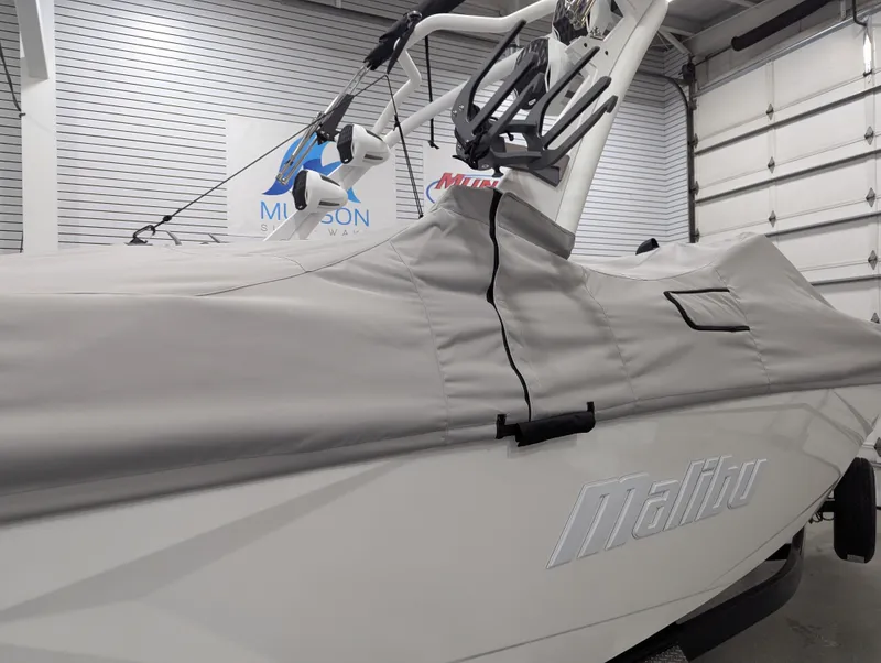 Slide: The Image of 2025 Malibu Wakesetter 23 LSV boat covered in a garage setting. - 26