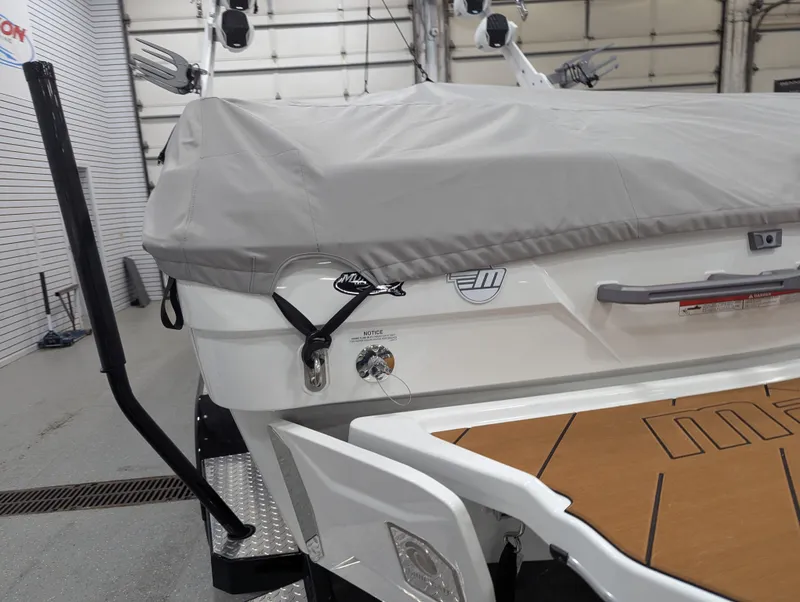 Slide: The Image of 2025 Malibu Wakesetter 23 LSV boat with cover in a garage setting. - 27