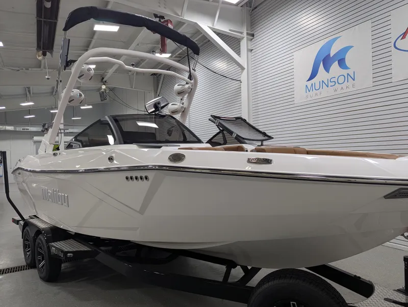 Slide: The Image of 2025 Malibu Wakesetter 23 LSV boat in showroom, sleek design, Munson Surf & Wake. - 3