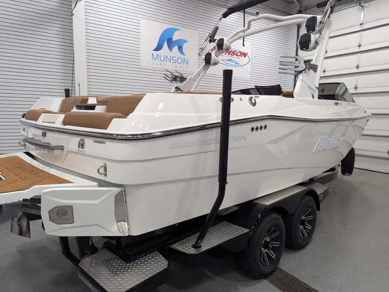 Slide: The Image of 2025 Malibu Wakesetter 23 LSV boat on trailer in showroom. - 4